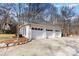 Three-car garage with white brick exterior at 4001 Carmel Acres Dr, Charlotte, NC 28226