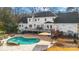 Luxury home with kidney-shaped pool and spacious deck at 4001 Carmel Acres Dr, Charlotte, NC 28226