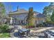 This backyard features a large patio, a dining table, and an outdoor kitchen area at 4004 Blossom Hill Dr, Matthews, NC 28104