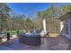 This deck features outdoor seating and views of the surrounding trees at 4004 Blossom Hill Dr, Matthews, NC 28104