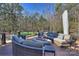 This deck features outdoor seating and views of the surrounding trees at 4004 Blossom Hill Dr, Matthews, NC 28104