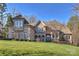 Stunning two-story home featuring a lush lawn and well-manicured landscaping at 4004 Blossom Hill Dr, Matthews, NC 28104