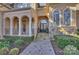 Elegant home entrance featuring a paved walkway and a stylish arched doorway at 4004 Blossom Hill Dr, Matthews, NC 28104