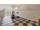 This home gym has a checkered floor and plenty of space for exercise equipment at 4004 Blossom Hill Dr, Matthews, NC 28104