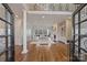 Bright and airy living room with hardwood floors, a fireplace, and large windows at 4004 Blossom Hill Dr, Matthews, NC 28104