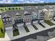 A neighborhood aerial showcases modern townhomes with neat landscaping, driveways, and green spaces at 432 Burr St, Indian Trail, NC 28079