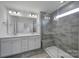 Elegant bathroom featuring double sinks and a glass-enclosed shower at 432 Burr St, Indian Trail, NC 28079