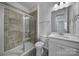 Bathroom featuring tiled shower and vanity with sink at 432 Burr St, Indian Trail, NC 28079