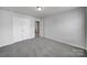 Cozy bedroom featuring neutral walls, carpet, and closet at 432 Burr St, Indian Trail, NC 28079