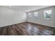 Bonus room with natural light and dark wood laminate flooring at 432 Burr St, Indian Trail, NC 28079