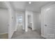 Hallway with doors leading to a bathroom and bedroom at 432 Burr St, Indian Trail, NC 28079