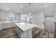 Kitchen featuring a large island with pendant lighting and hardwood floors at 432 Burr St, Indian Trail, NC 28079