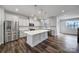 Bright, modern kitchen with stainless steel appliances, quartz countertops, and hardwood floors at 432 Burr St, Indian Trail, NC 28079