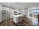 Bright, modern kitchen with stainless steel appliances, quartz countertops, and hardwood floors at 432 Burr St, Indian Trail, NC 28079