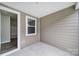 A clean, covered patio offers a versatile space for customization with views of the home's interior at 432 Burr St, Indian Trail, NC 28079