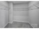 Spacious walk-in closet with wire shelving and carpet flooring at 432 Burr St, Indian Trail, NC 28079