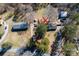 Aerial view of house, sheds and garages on lot with mature trees and long driveway at 4428 Turkey Ln, Rock Hill, SC 29730