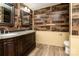 Rustic bathroom with double sinks, wood look walls, and granite countertop at 4428 Turkey Ln, Rock Hill, SC 29730