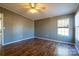 Bedroom with ceiling fan, wood laminate flooring, and a neutral color palette at 4428 Turkey Ln, Rock Hill, SC 29730