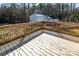 Exterior shot of the wooden deck with a view of the backyard and storage sheds at 4428 Turkey Ln, Rock Hill, SC 29730