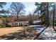 View of home and outbuildings, enhanced by a newly built privacy fence at 4428 Turkey Ln, Rock Hill, SC 29730