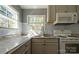 Close up on modern kitchen features with subway tile and granite countertops at 4428 Turkey Ln, Rock Hill, SC 29730