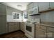 Well-lit kitchen with gray countertops and subway tile backsplash and stainless steel sink at 4428 Turkey Ln, Rock Hill, SC 29730