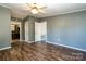 Bedroom with ceiling fan, wood laminate flooring, a neutral color palette, and ensuite bathroom at 4428 Turkey Ln, Rock Hill, SC 29730