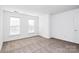 Well-lit bedroom with neutral decor and carpet at 6019 Queens Walk Ct, Indian Land, SC 29707