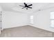 Well-lit bedroom featuring neutral wall colors and carpet at 6019 Queens Walk Ct, Indian Land, SC 29707