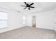 Spacious bedroom with ceiling fan and neutral carpeting at 6019 Queens Walk Ct, Indian Land, SC 29707