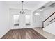 Bright dining room with hardwood floors and chandelier at 6019 Queens Walk Ct, Indian Land, SC 29707