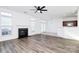 Open living area with hardwood floors, fireplace and kitchen at 6019 Queens Walk Ct, Indian Land, SC 29707