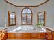 Bathroom featuring a marble-topped vanity and a jetted tub at 6020 Havencrest Nw Ct, Concord, NC 28027