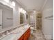 Bathroom with granite countertop, double sinks and glass block shower at 6020 Havencrest Nw Ct, Concord, NC 28027