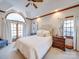 Bright bedroom with vaulted ceiling, plush bedding, and a ceiling fan at 6020 Havencrest Nw Ct, Concord, NC 28027