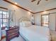 Spacious bedroom with vaulted ceiling, neutral decor, and a sliding barn door at 6020 Havencrest Nw Ct, Concord, NC 28027