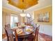 Formal dining room with wood table and neutral decor at 6020 Havencrest Nw Ct, Concord, NC 28027