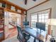 Home office with built-in shelves and two monitors at 6020 Havencrest Nw Ct, Concord, NC 28027