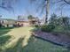 House exterior showcasing a side view and landscaping at 6020 Havencrest Nw Ct, Concord, NC 28027