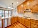 Spacious kitchen featuring wood cabinets, granite countertops, and stainless steel appliances at 6020 Havencrest Nw Ct, Concord, NC 28027