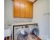 Laundry room with washer, dryer, cabinets, and utility sink at 6020 Havencrest Nw Ct, Concord, NC 28027