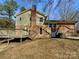 Home's back features a deck and a large backyard at 7401 Limerick Dr, Charlotte, NC 28270