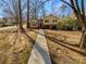 House exterior showcasing a walkway to the entrance at 7401 Limerick Dr, Charlotte, NC 28270