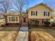 Brick and vinyl siding home with steps leading to the front entrance at 7401 Limerick Dr, Charlotte, NC 28270