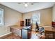 Functional home office with wood desk, stylish shelving, and a comfortable office chair at 7707 Ritter Dr, Charlotte, NC 28270