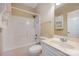 This bathroom has a vanity with sink and a bathtub shower combination with white walls at 781 Woodlawn Ave, Mount Holly, NC 28120