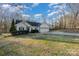 Traditional one-story home featuring a well-maintained lawn and attached two-car garage at 781 Woodlawn Ave, Mount Holly, NC 28120