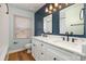 Bathroom featuring dual sinks, modern fixtures, and stylish decor at 8025 Cliffside Dr, Charlotte, NC 28270