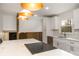 Kitchen featuring a large island with white countertops and dark cabinets at 8025 Cliffside Dr, Charlotte, NC 28270